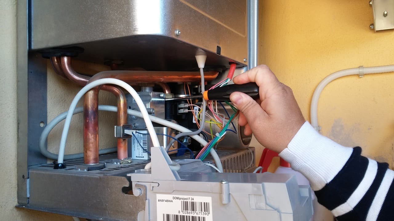 Man fixes water heater