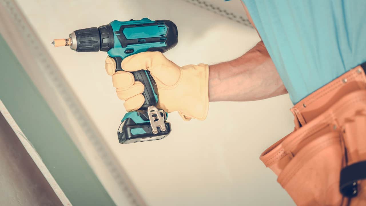 Man holds drill driver