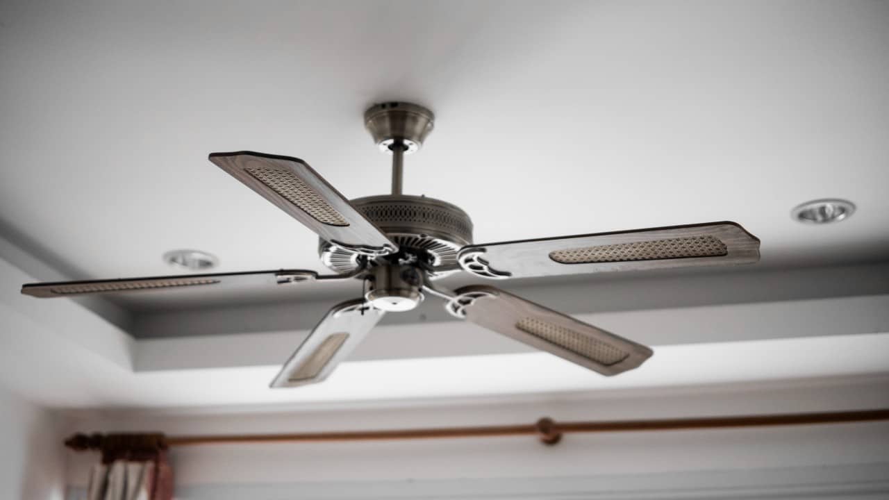 Wooden ceiling fan in a room