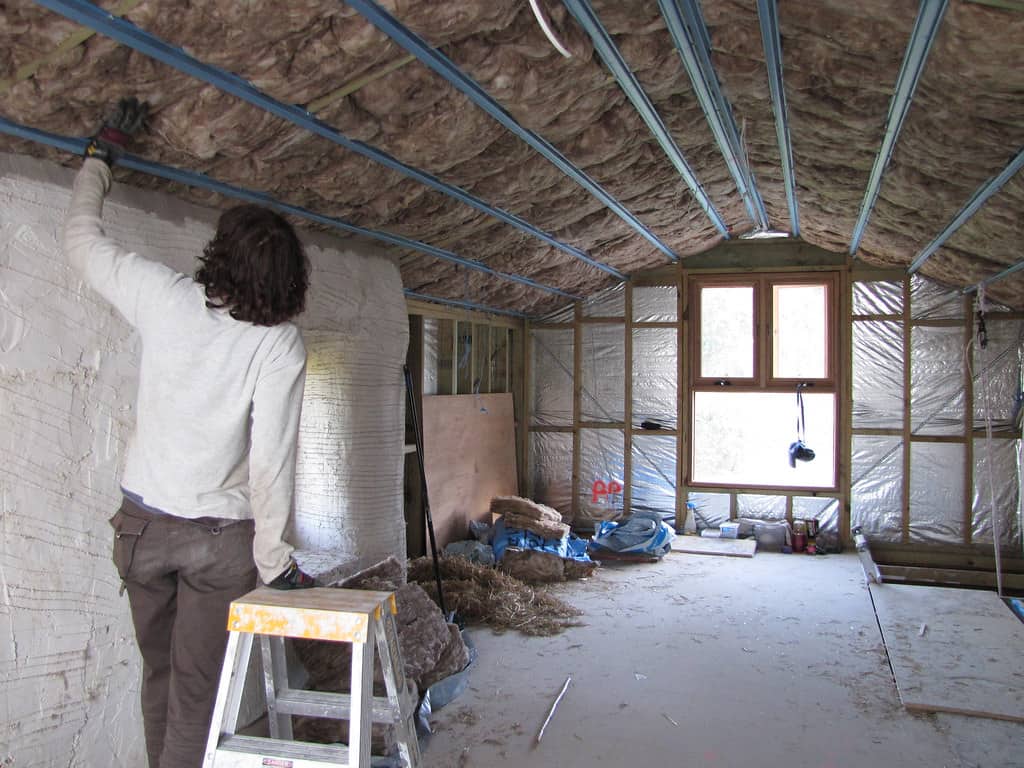 Attic insulation being installed