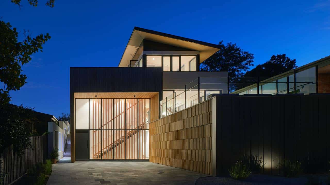 A well-lit contemporary home in the night